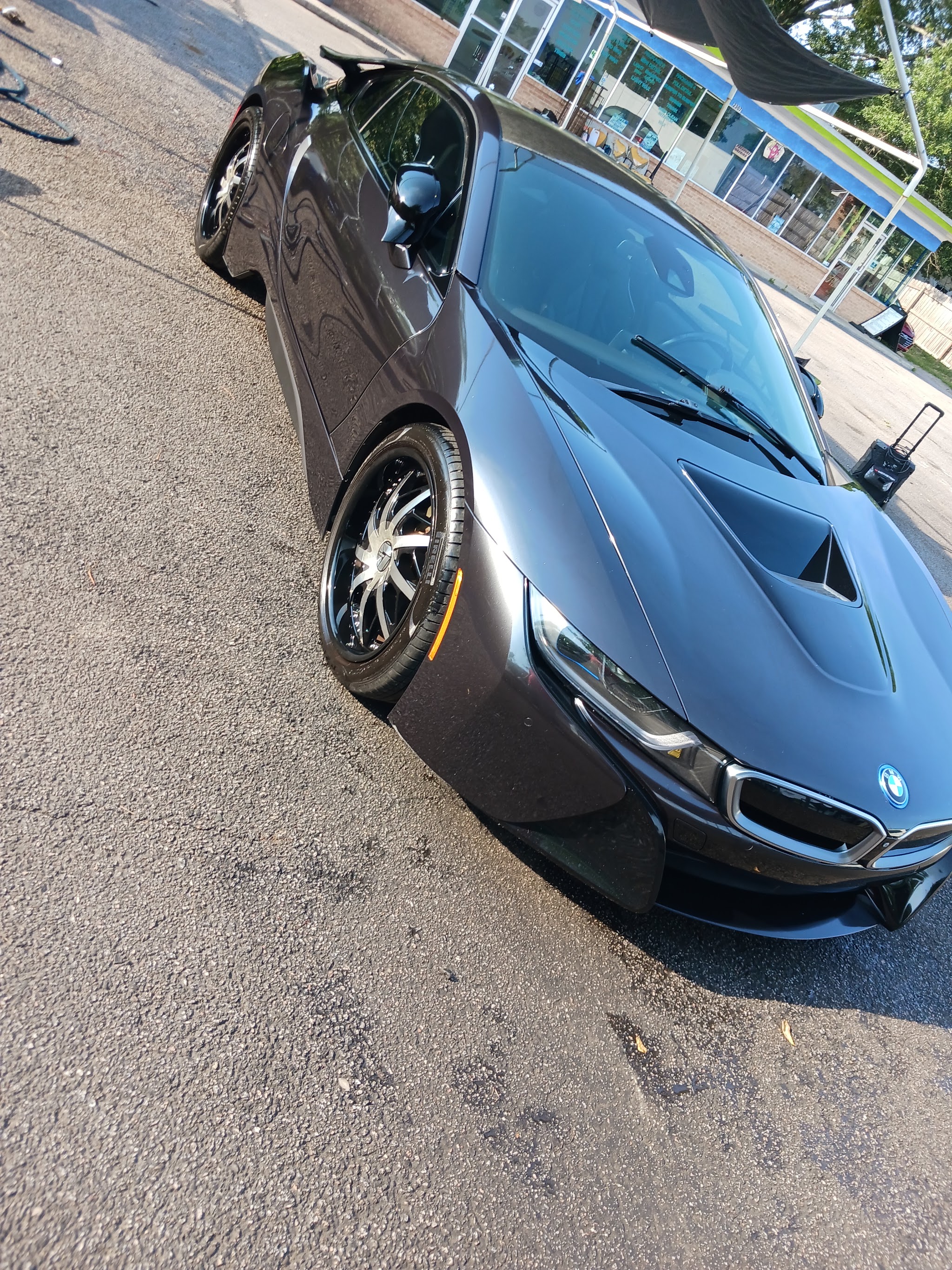 Dark BMW i8 freshly washed