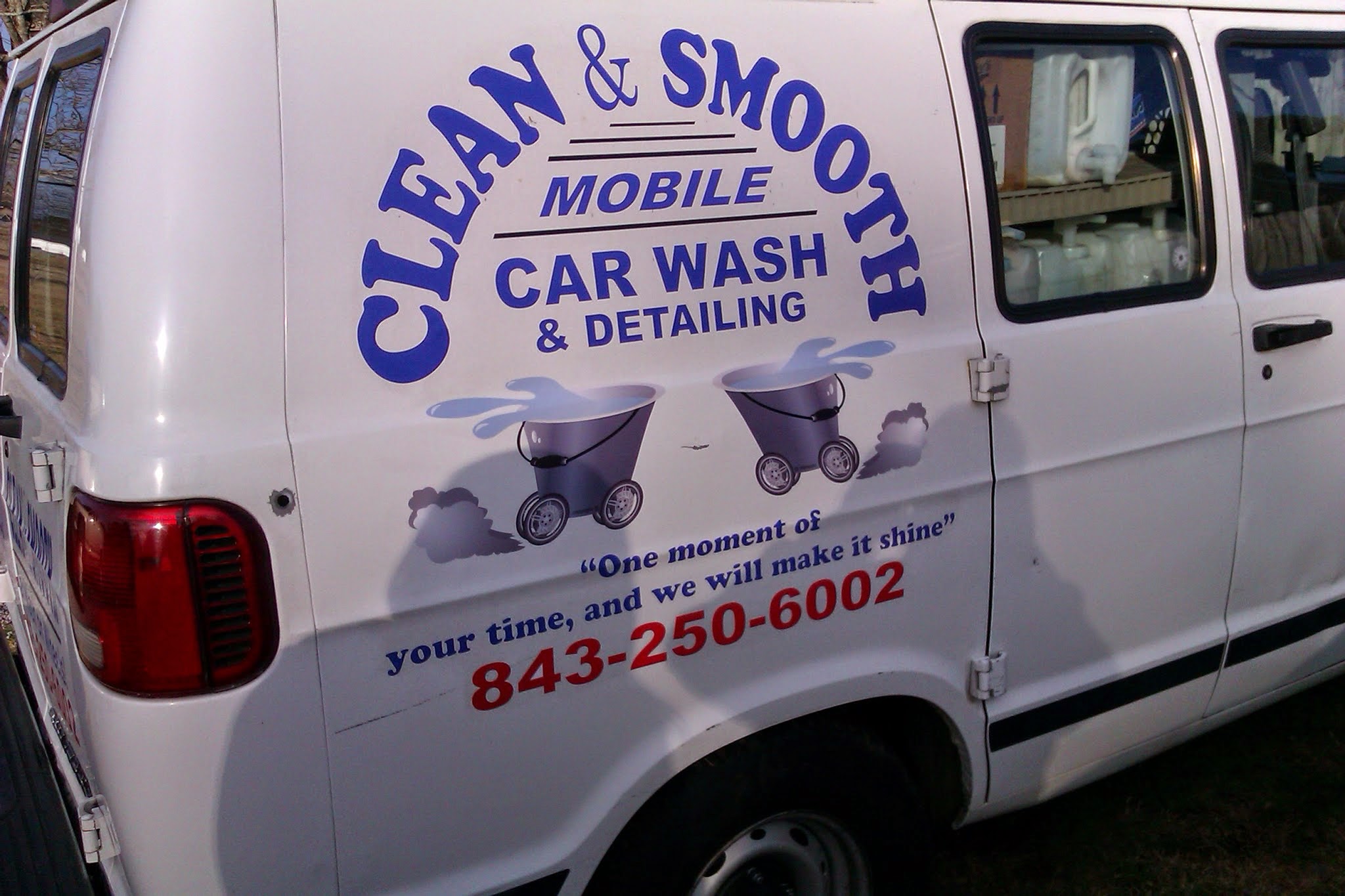 Our van, lettered Clean & Smooth Mobile Car Wash and Detailing, 843-250-6002
