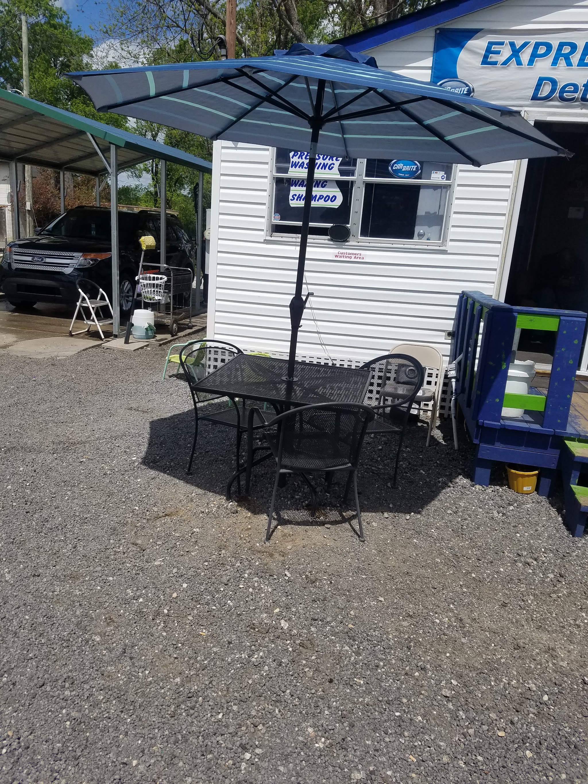 Our shop on East Palmetto Street with a shaded seating area